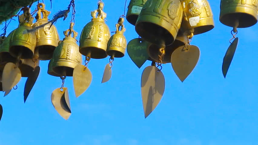 wind chimes on blue sky background 