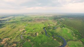 River panorama. Aerial View: Flight over the Beautiful River and Green Fields. Kiev, Ukraine. 4K resolution.