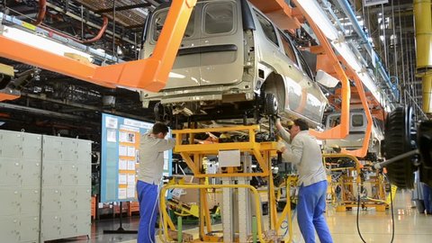 TOGLIATTI - SEP 30: People work at assembly of cars Lada Kalina on conveyor of factory AutoVAZ, on September 30, 2011 in Togliatti, Russia.
