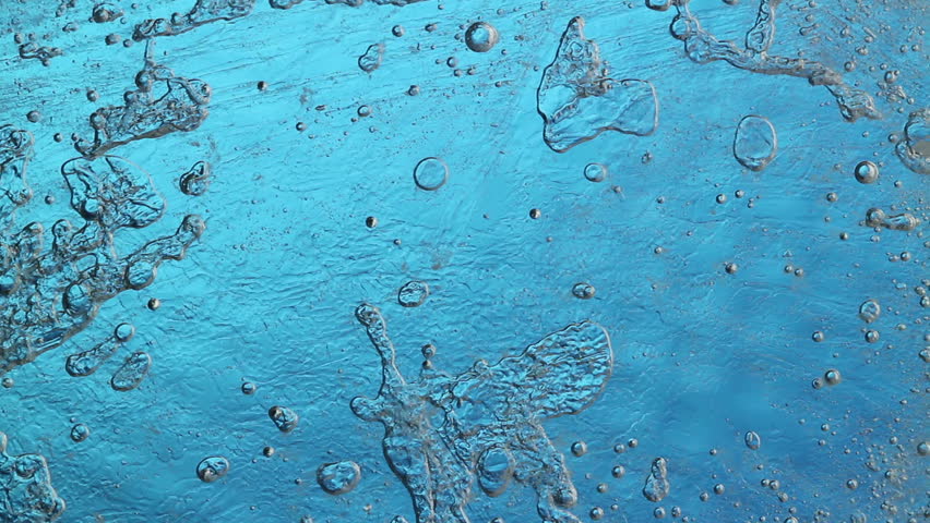 melting ice closeup on blue background