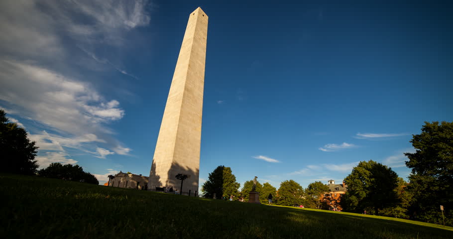 Boston, Massachusetts, USA - Bunker Hill Monument with moving shadow at sunny day with blue sky and clouds - Timelapse with zoom in - September 2012
