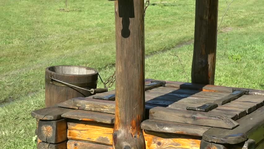 Beautiful artful wooden well, tilt and zoom
