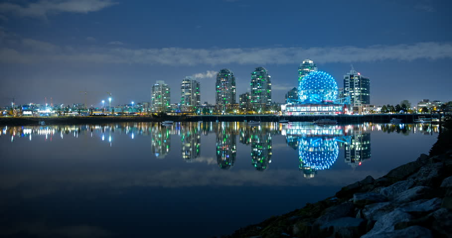 Vancouver, British Columbia, Canada - view over False Creek of illuminated Science World in Creekside Park at night - Timelapse with zoom in - October 2014