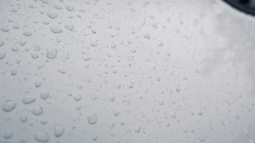Rraindrops on the surface of car - close-up raindrops | Shutterstock HD Video #17693131