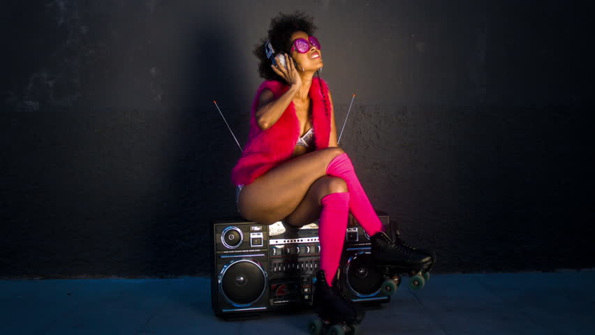 a cool roller skating woman dances and skates outside in an urban setting