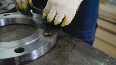Worker Measures The Diameter with The Flange Caliper