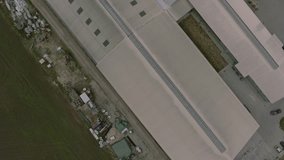 Aerial drone flying over a dairy farm in 4k UHD video. 