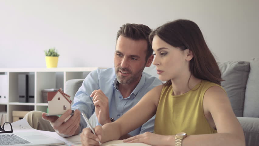 Happy couple planning expenses for new home Royalty-Free Stock Footage #17710231