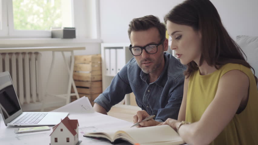Couple, architects at home planning new house design Royalty-Free Stock Footage #17710237
