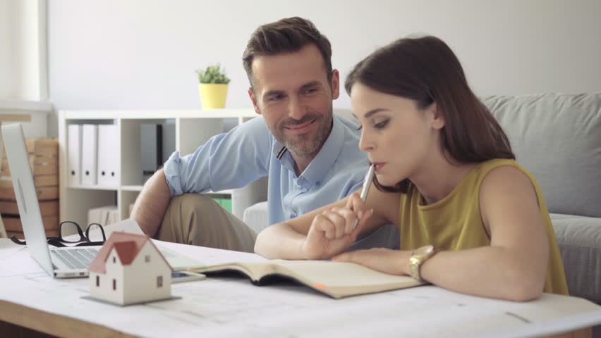 Happy couple planning their future home design Royalty-Free Stock Footage #17710282