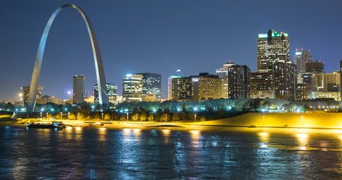 St. Louis, Missouri, USA - view of the illuminated city at night with the Gateway Arch monument and the Mississippi River - Timelapse with pan right to left - October 2014