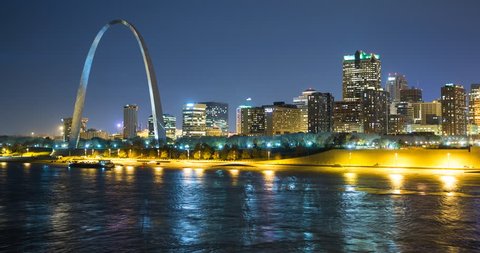 St. Louis, Missouri, USA - view of the illuminated city at night with the Gateway Arch monument and the Mississippi River - Timelapse with zoom in - 11/14