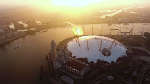 4K Aerial Footage Video Flying by London O2 Arena Concert Hall by the River Thames Waterway at Sunrise Dawn Time Ultra HD - UHD