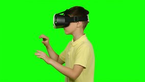Boy use virtual reality headset helmet. Green screen - Powered by Shutterstock - Get 15% off with code: PIKWIZARD15