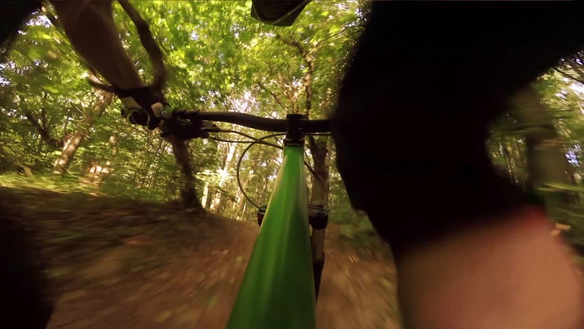 Mountain biking down hill. View from biker.