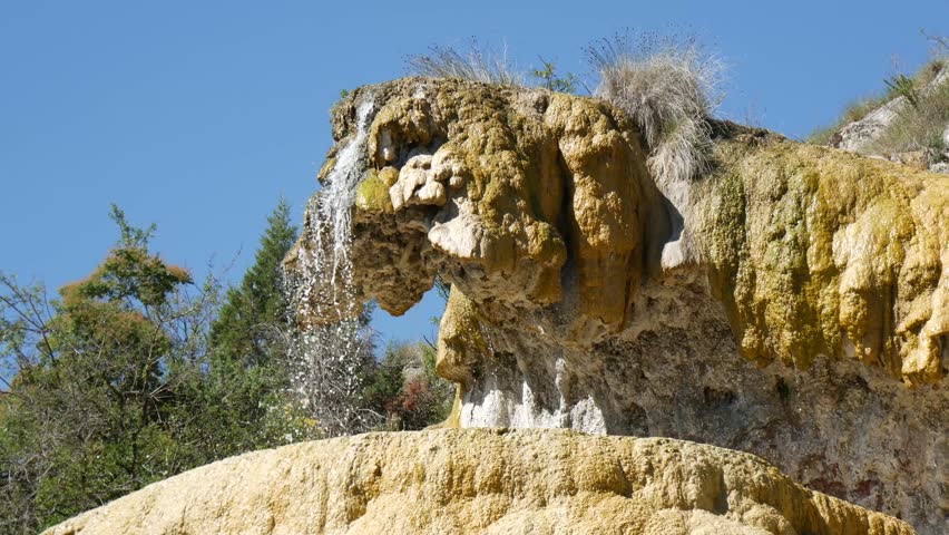 a petrified fountain.   Located in the french area known as Reotier it is a waterfall that has brought millennia of sediment out of the ground to form an alien rock formation.
