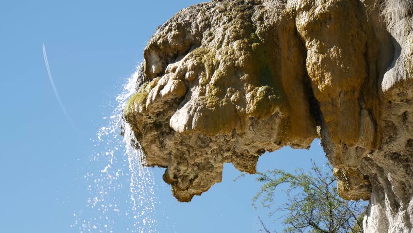 a petrified fountain.   Located in the french area known as Reotier it is a waterfall that has brought millennia of sediment out of the ground to form an alien rock formation.