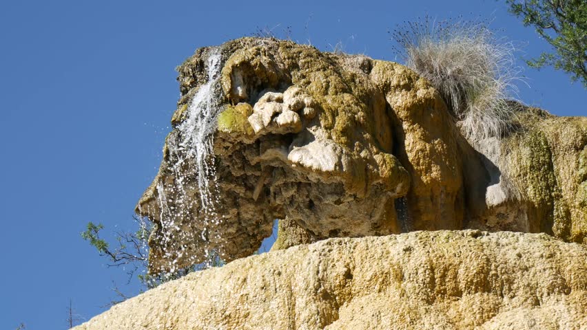 a petrified fountain.   Located in the french area known as Reotier it is a waterfall that has brought millennia of sediment out of the ground to form an alien rock formation.