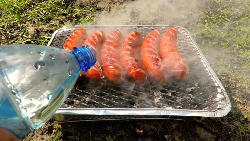 of Marine conservatief pouring water on disposable bbq charcoal Stock Footage Video (100%  Royalty-free) 17730187 | Shutterstock