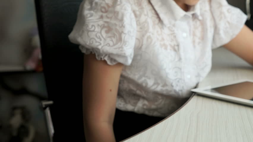 Teenager girl holding a digital tablet computer