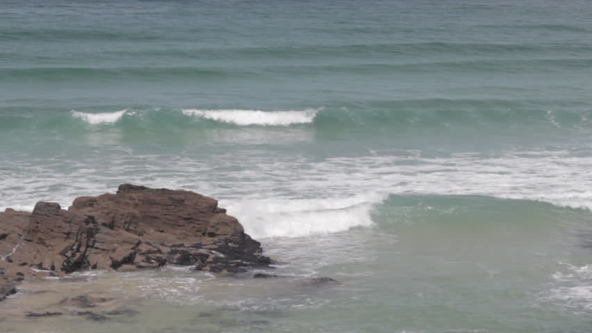 Waves breaking near rocks