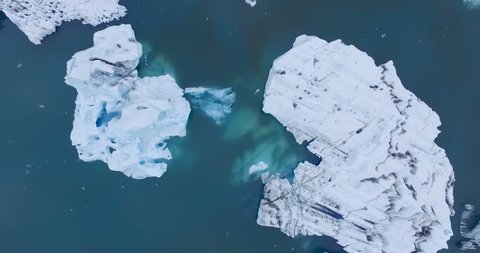 Birds eye view aerial shot of icebergs in water. Jokulsarlon Iceland.