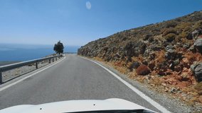 Driving on mountain road with roof camera on a sunny day in Crete Greece. Shoot on Digital Cinema Camera in 4k.