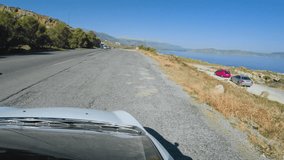 Driving on mountain road with roof camera on a sunny day in Crete Greece. Shoot on Digital Cinema Camera in 4k.