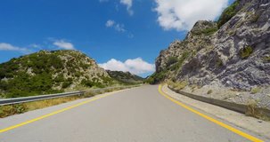 Driving on mountain road with roof camera time lapse on a sunny day in Crete Greece. Shoot on Digital Cinema Camera in time lapse.