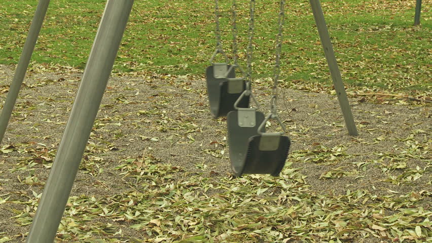 Empty swing seats at a playground