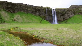 Morning view of Seljalandfoss Waterfall in summer. Iceland, Europe. Full HD video (High Definition).