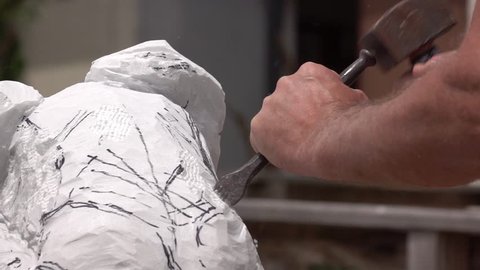 The artist creating sculpture of stone. Art studio. Slow Motion. Close-up shot