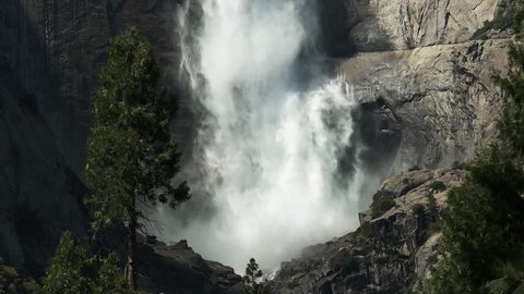 close up of water crashing into the base of the first section of yosemite falls in yosemite national park