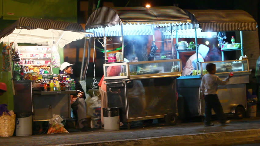 BANOS DE AGUA SANTA, ECUADOR - DECEMBER 10: street vendors preparing food in