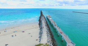 Aerial 4K video of South Beach, Miami Beach. Amazing bird's view on most famous beach in the World and South Pointe Park.