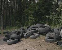 Used tires dumped in the outskirts. Environmental pollution. 