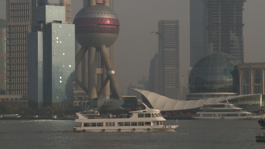 Boat Sails Through Downtown Shanghai