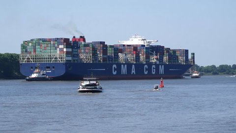 HAMBURG, GERMANY - CIRCA JUNE 2016: Containership CMA CGM Jules Verne leaving port of Hamburg