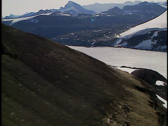 Aerial flight over large Rocky Mountain glacier