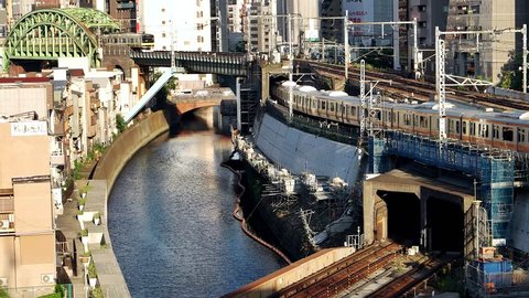 Tokyo - June 2016: Trains riding in different directions at Ochanomizu railway junction. 4K resolution