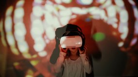 Little girl using VR-helmet. vr dance simulator