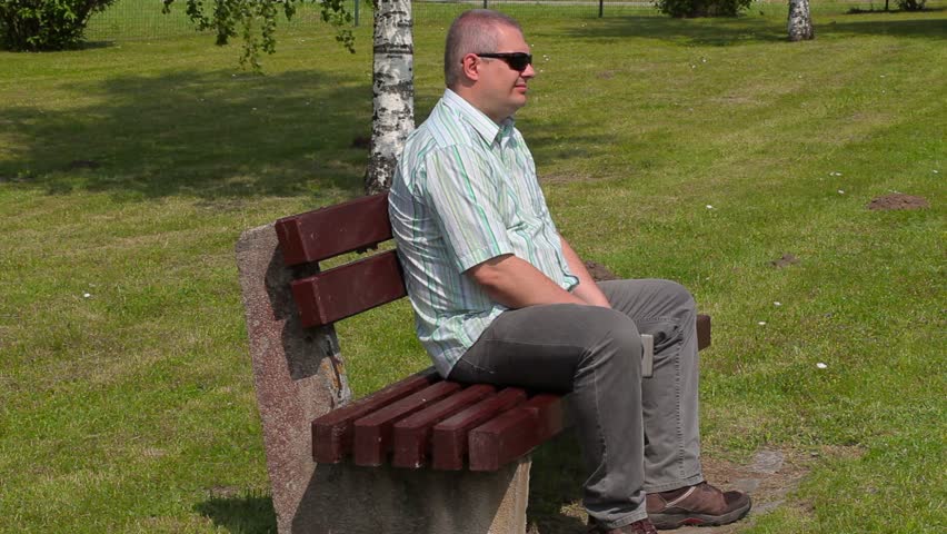 Man sitting and watching tablet PC 