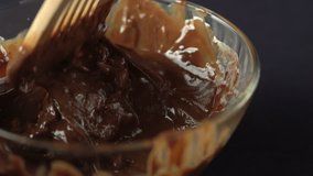 Mixing cream with melted chocolate
