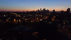 Twilight Aerial Flying Drone Wide Shot of Downtown Minneapolis Skyline and Seward Neighborhood Traffic HD Video Clip