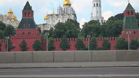 Athletic young man running against Moscow Kremlin 4K steadicam video