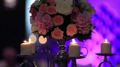 Wedding table decorated with flowers, decorative glass candles