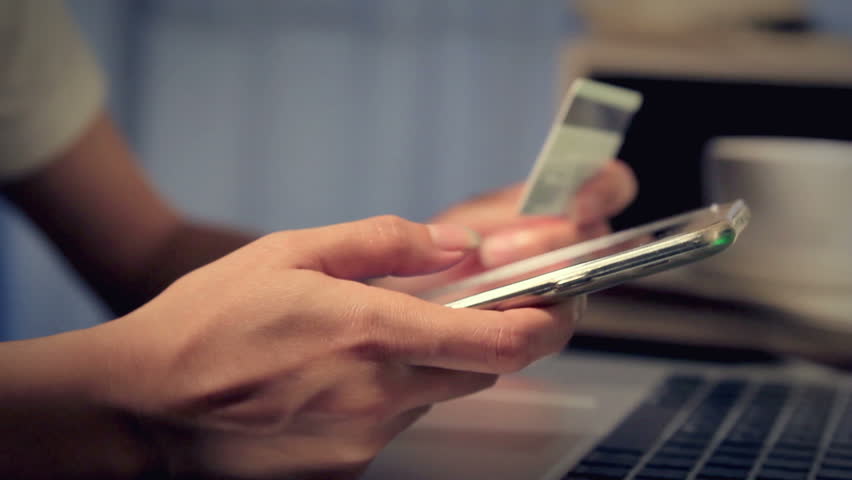 Woman using credit card with smartphone shopping online Royalty-Free Stock Footage #17779375