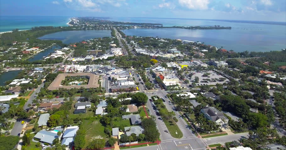 The bullseye of St. Armands Circle turns below as the boulevard runs north toward New Pass.