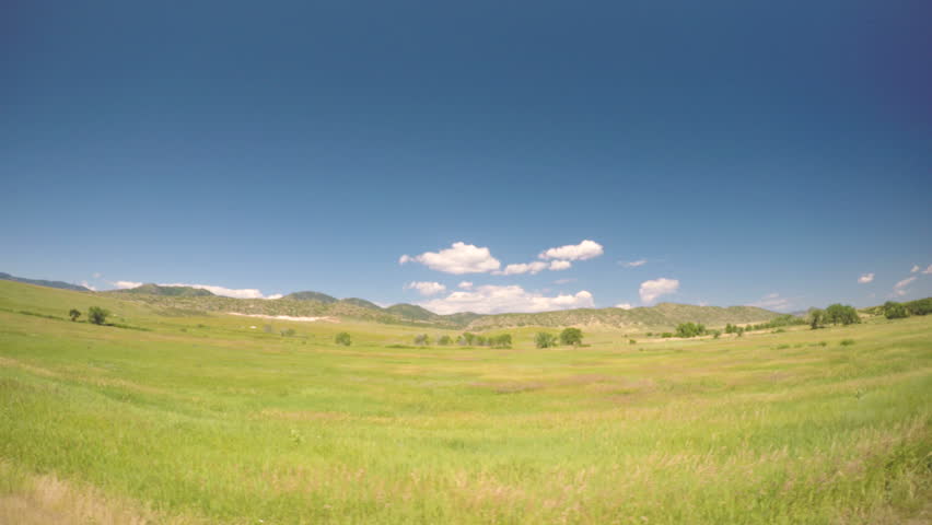 Car driving through grassland at Chatfield State Park.-POV point of view.