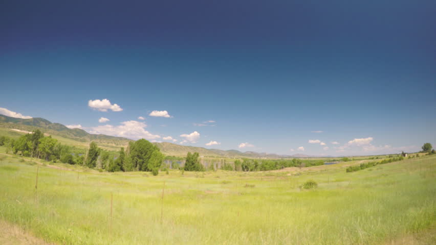 Car driving through grassland at Chatfield State Park.-POV point of view.